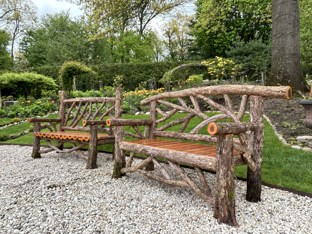 Rustic bench custom built using cedar trees and branches titled the Cedar Benches