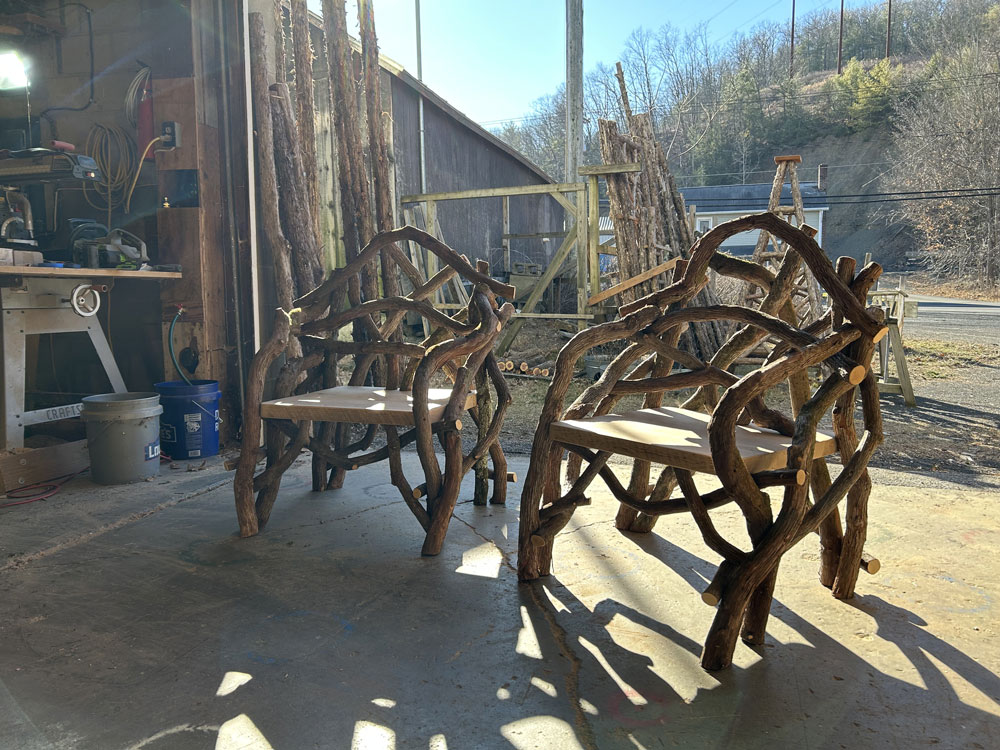 Outdoor rustic park bench built using mountain laurel trees and branches titled the Mountain Laurel Chairs