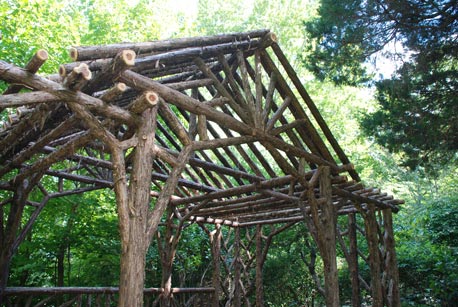 Rustic pavilion built in the rustic style using logs and branches titled the Martin Dining Pavilion