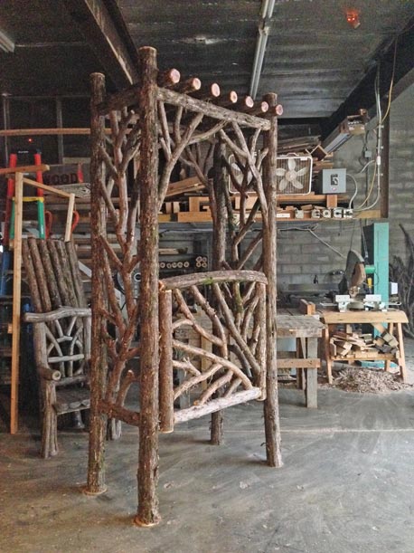 Rustic garden arbor built using bark-on trees and branches titled the Zinke Arbor & Gate