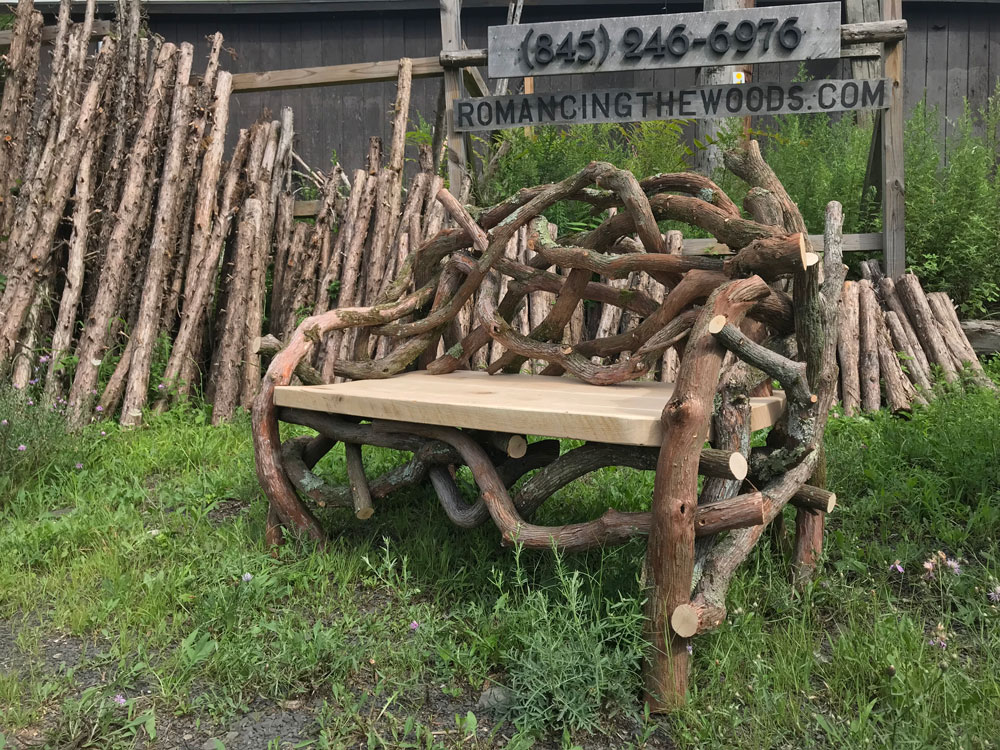 Rustic bench custom built using cedar trees and branches.