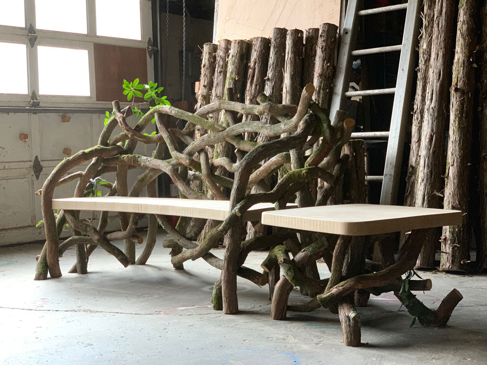Outdoor rustic bench and side table built using mountain laurel trees and branches titled the Mountain Laurel Bench & Table Set