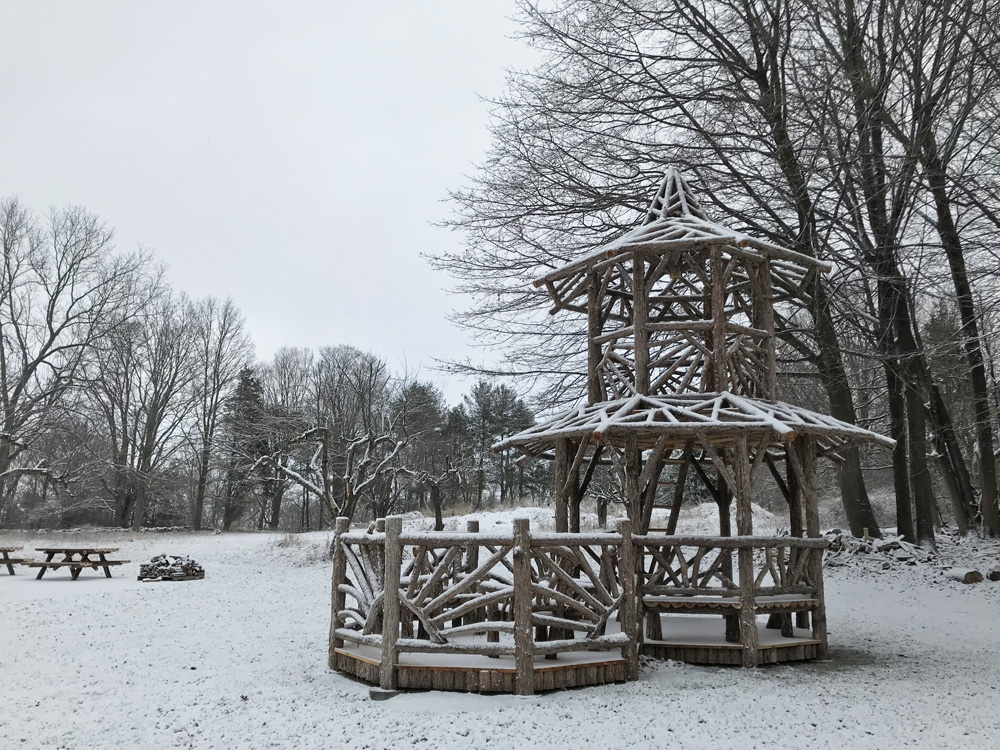 Outdoor rustic two story gazebo tower built using bark-on trees and branches titled the Taunton Hill Tree Tower