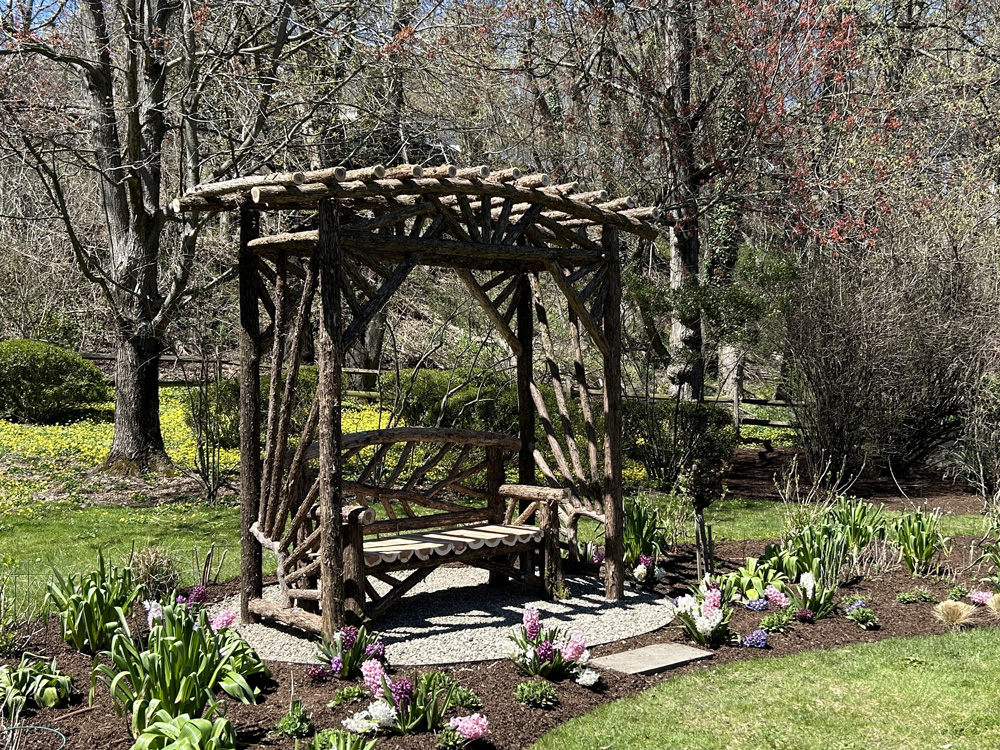 Branchwork rustic arbor and bench constructed using natural materials titled the Greenwich Arbor & Bench