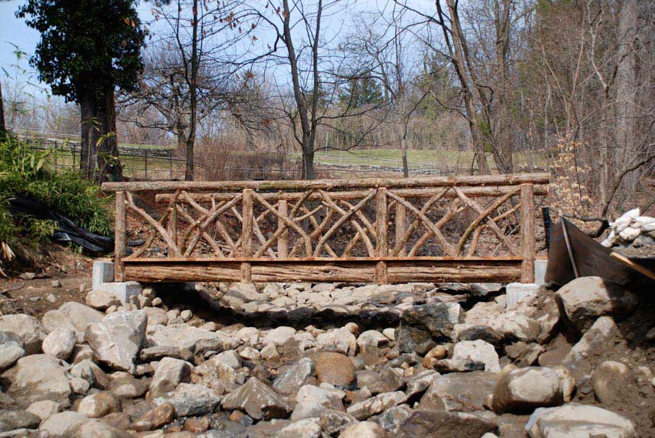 Bridge built in the rustic style using logs and branches at Sunnyside Historic Site