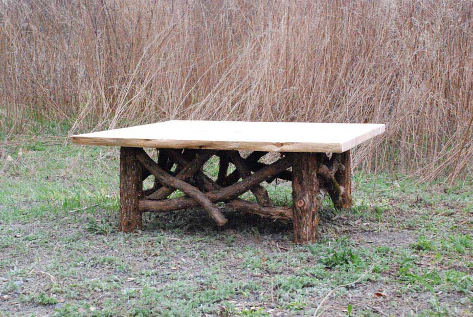 Outdoor rustic patio table built using bark-on trees and branches titled the Bengur Coffee Table