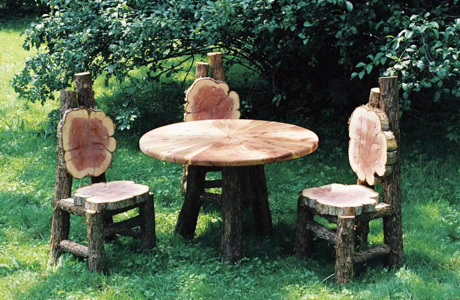 Natural wood chair and table set for children built with bark-on trees, branches, and logs titled the Wegerzyn Children's Table & Chairs