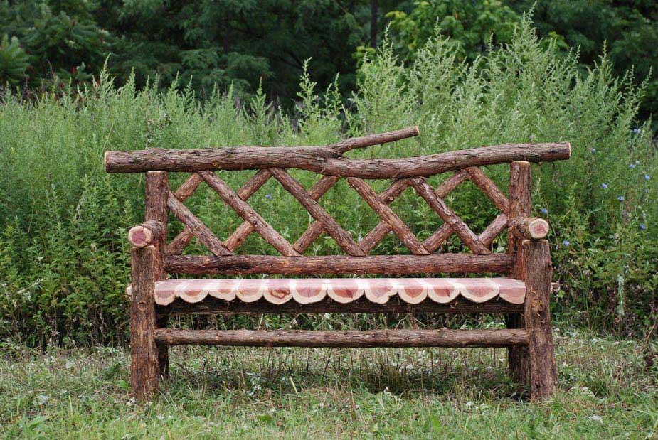 Rustic bench custom built using cedar trees and branches titled the Madison
