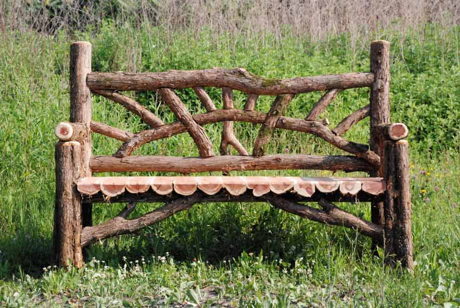 Natural wood bench built with trees and branches titled the Waterloo
